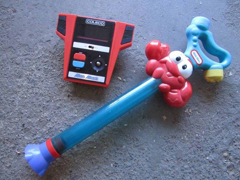 lot 10 image: Vintage bubble blower and game cont...