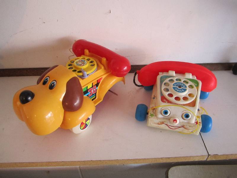 lot 59 image: Toy telephones...