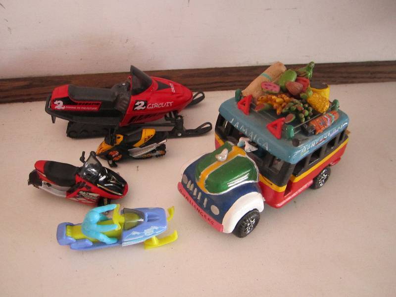 lot 62 image: Toy snowmobiles and Jamaica fruit t...