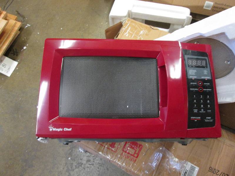 Red Microwave by Magic Chef open bo...