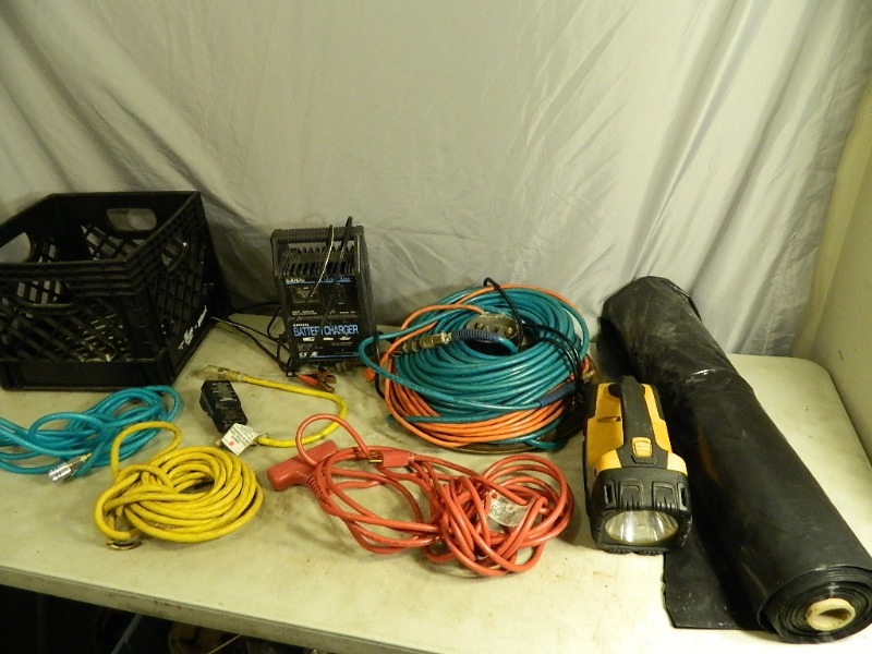 lot 108 image: Extension Cords, Air Hose, Battery Charger, and More