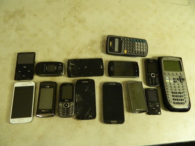 lot 124 image: Assorted Cellphones, IPod, and Ti-89 Calculator