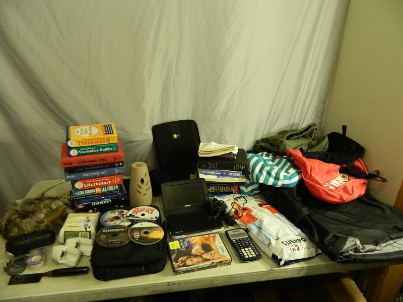 lot 197 image: Books, Bags, Portable DVD Player, and More