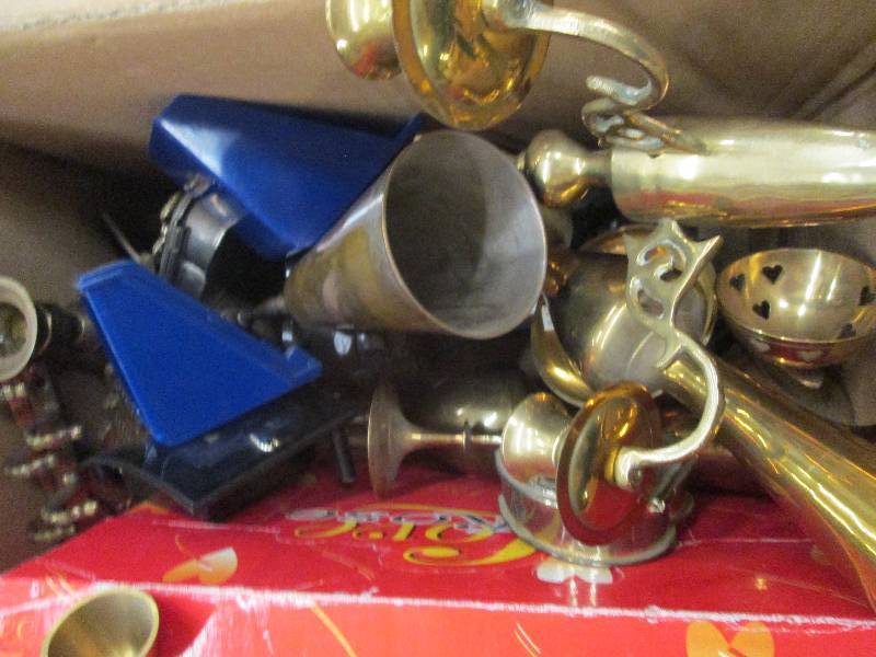 a bunch of brass candle holders and...