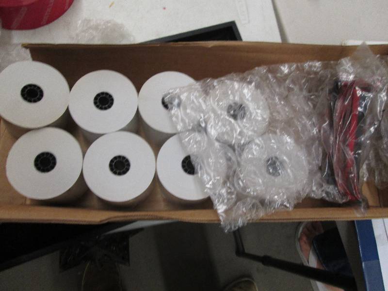 rolls of cash registar paper and in...
