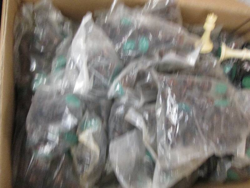 big box of chess pieces all unopene...