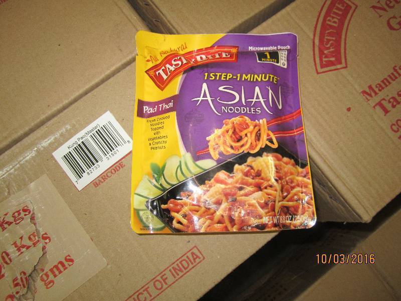 lot 285 image: Lot of 5 cases, 48 packs per case Tasty Bites pad thai asian noodles, sell by date May 2015, manufacturer states these stay fresh 18 months after sell by date.