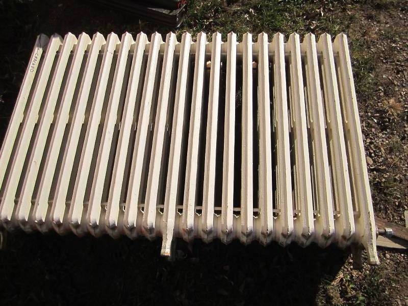 lot 101 image: Metal radiator, cracked...