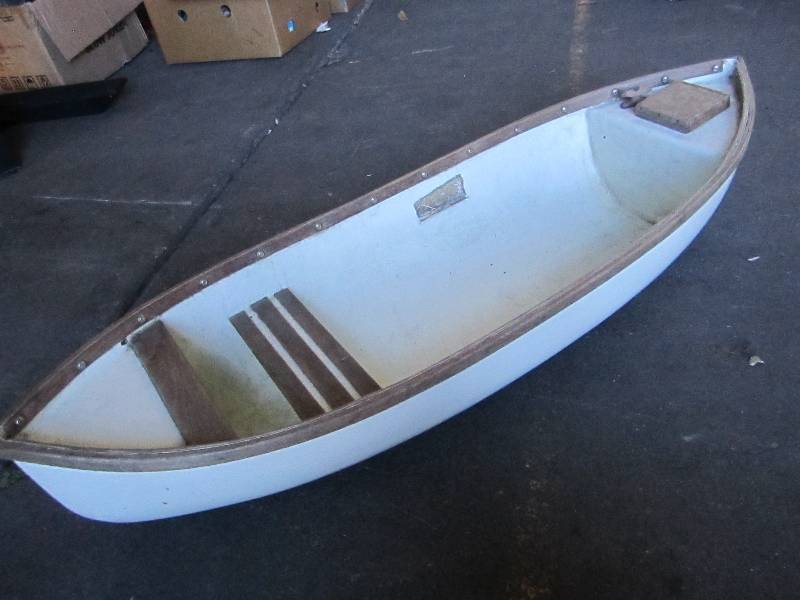 lot 104 image: Fiberglass wood trim canoe, 49 lon...