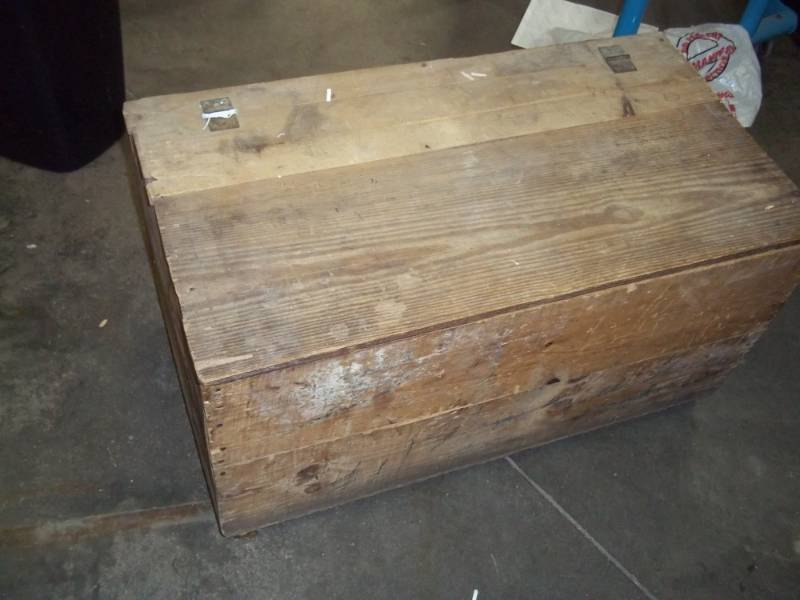 Vintage wood trunk on wheels