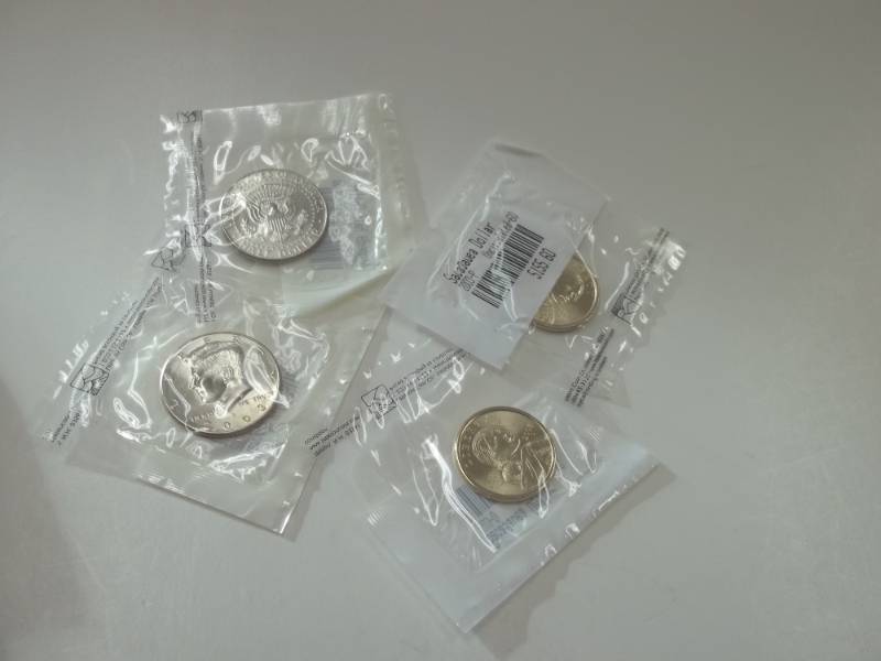 Complete 2003 Uncirculated Kennedy half and Sacagawea Dollar set