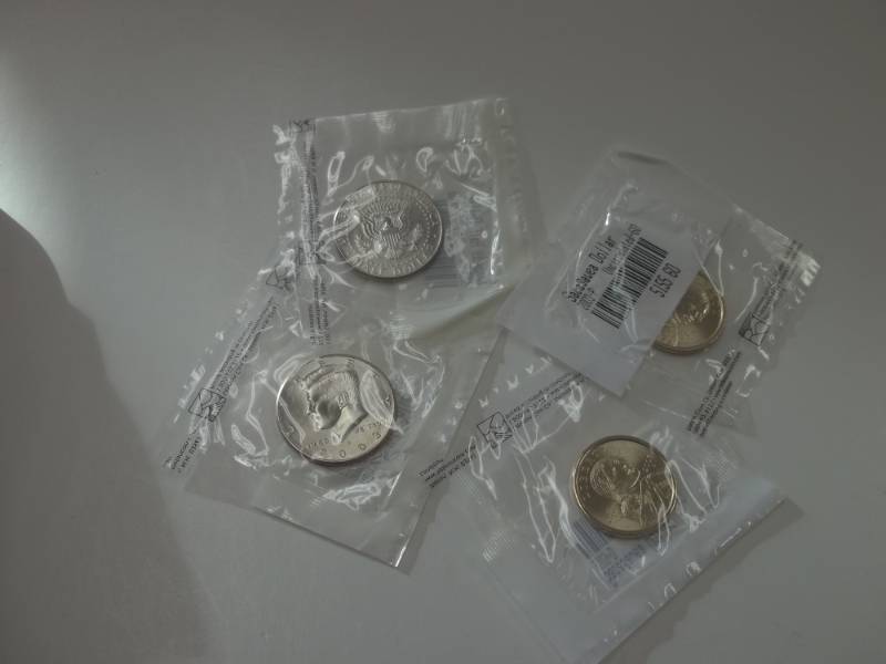 Complete 2003 Uncirculated Kennedy half and Sacagawea Dollar set