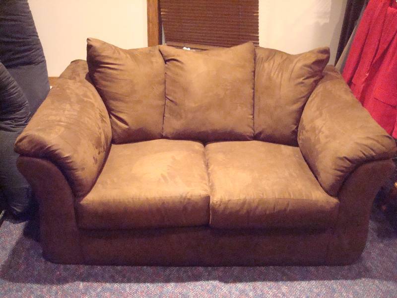 lot 8 image: Brown Micro Fiber Love Seat Couch, Used, Some Wear, Small Burn Mark, Marks, Has Legs