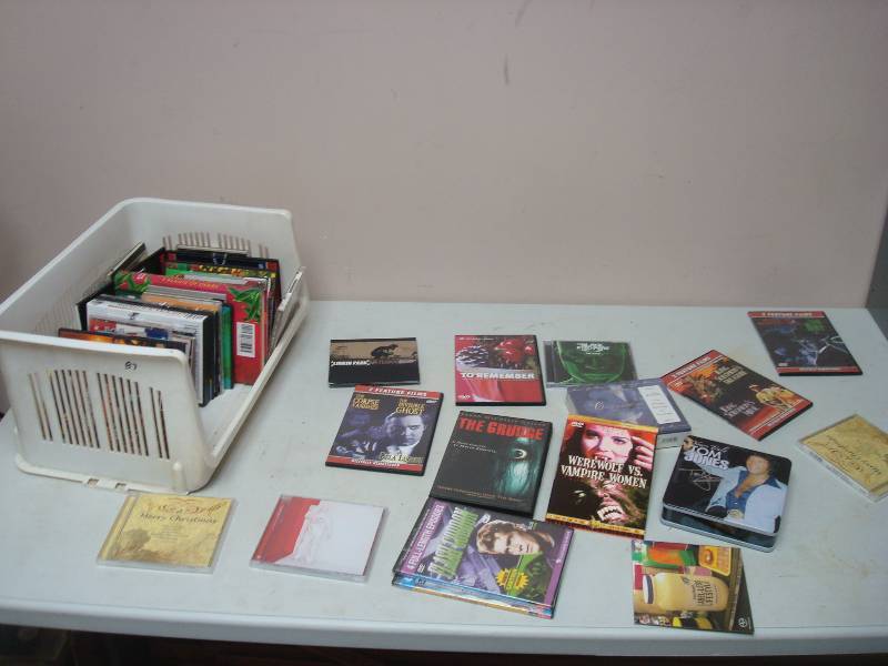 lot 27 image: Basket With Some CDs And DVDs, Most Are In Good Condition
