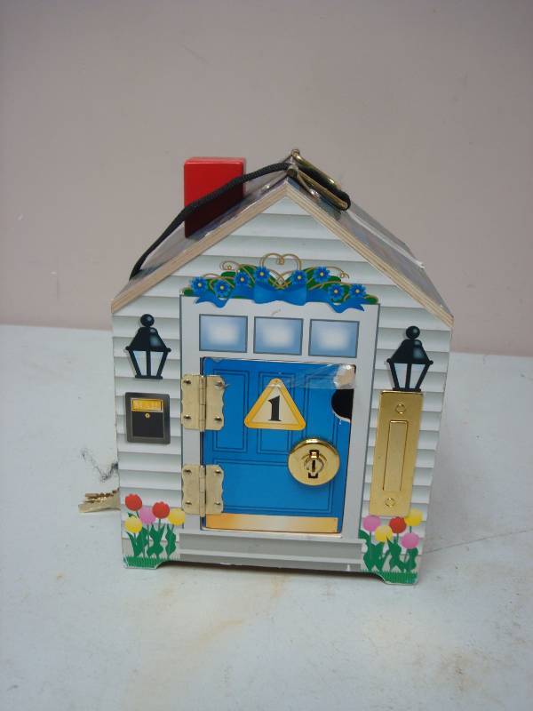 lot 137 image: Doug And Melissa Kids Toy Key House, Some Wear