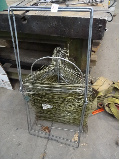 lot 57 image: Hanger Rack Filled with Wire Hangers