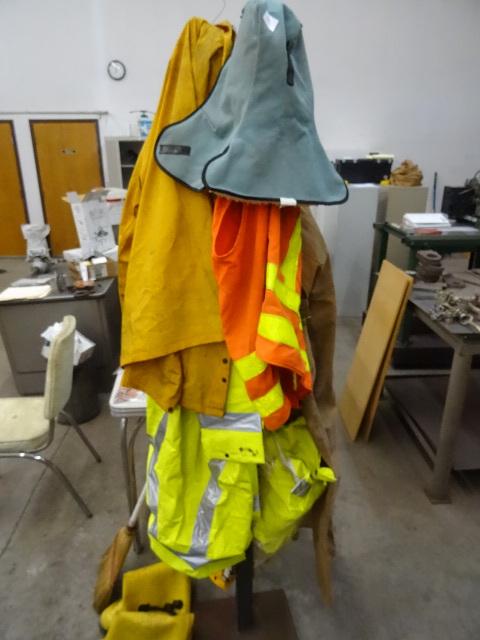 lot 152 image: Steel Coat Rack. Filled with Rain Jackets,