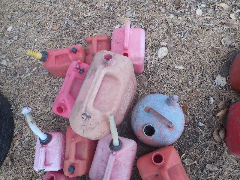 lot 42 image: RANDOM PILE OF GAS CANS