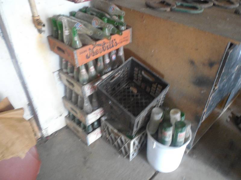 lot 84 image: STACK OF OLD SODA BOTTLES WITH CRATES