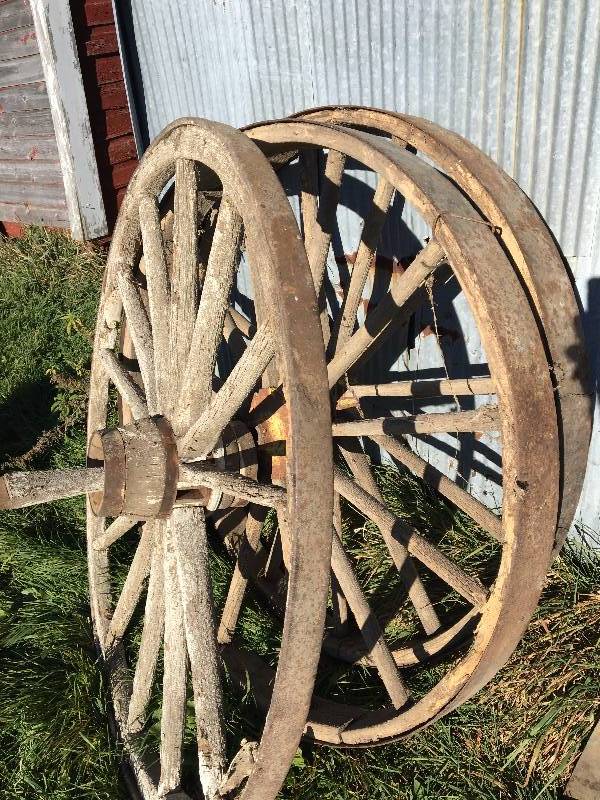 lot 55 image: WOOD SPOKED WHEELS WITH METAL RINGS