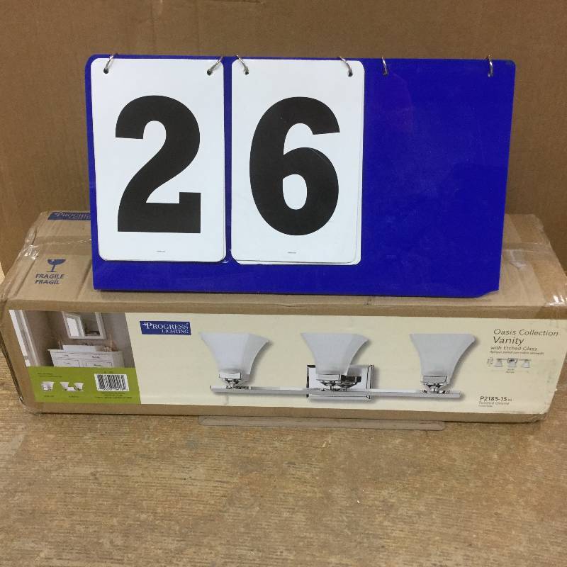 lot 26 image: Progress Lighting Oasis Collection 3-Light Polished Chrome Vanity Light, open box stock and actual photos used to display item