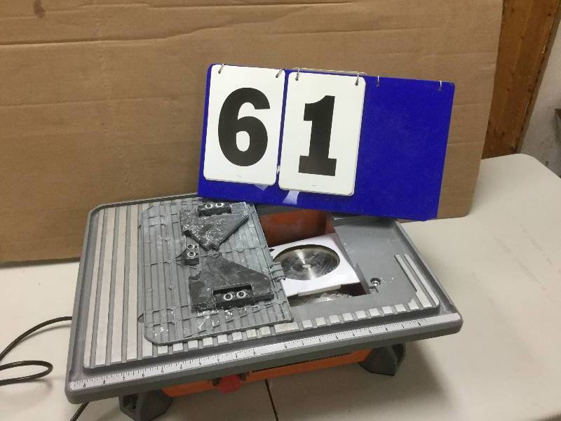 lot 61 image: RIDGID 7 in. Job Site Wet Tile Saw used in like new conditions open box