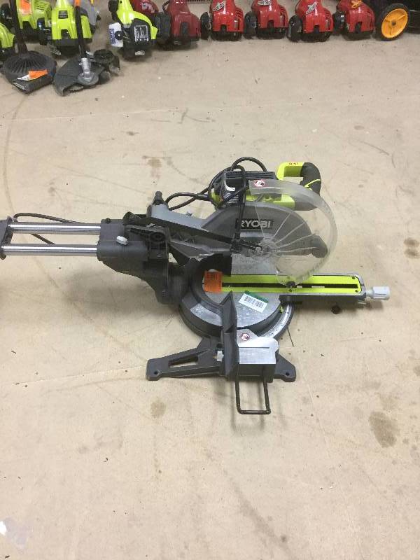 lot 99 image: Ryobi 15 Amp 12 in. Sliding Miter Saw with Laser used in working conditions
