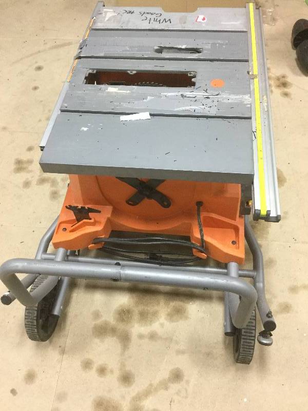 lot 100 image: RIDGID 15 Amp 10 in. Heavy-Duty Portable Table Saw with Stand used in working conditions