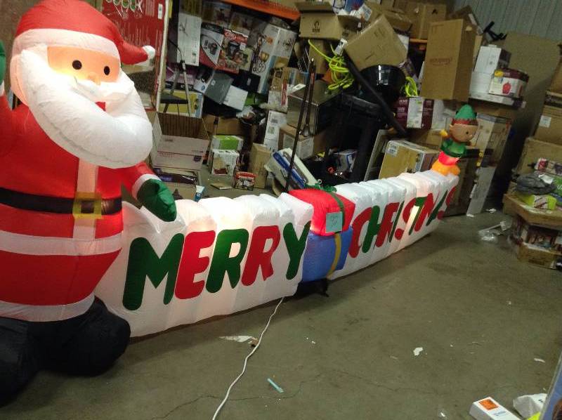 lot 92 image: Gemmy 12 ft. Long Inflatable Merry Christmas Sign Never used