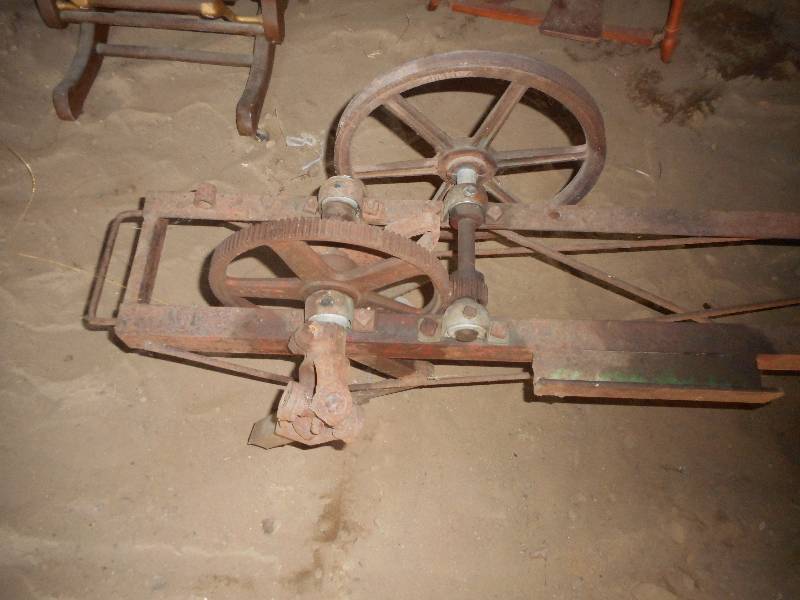 ANTIQUE IRON THING WITH PULLYS