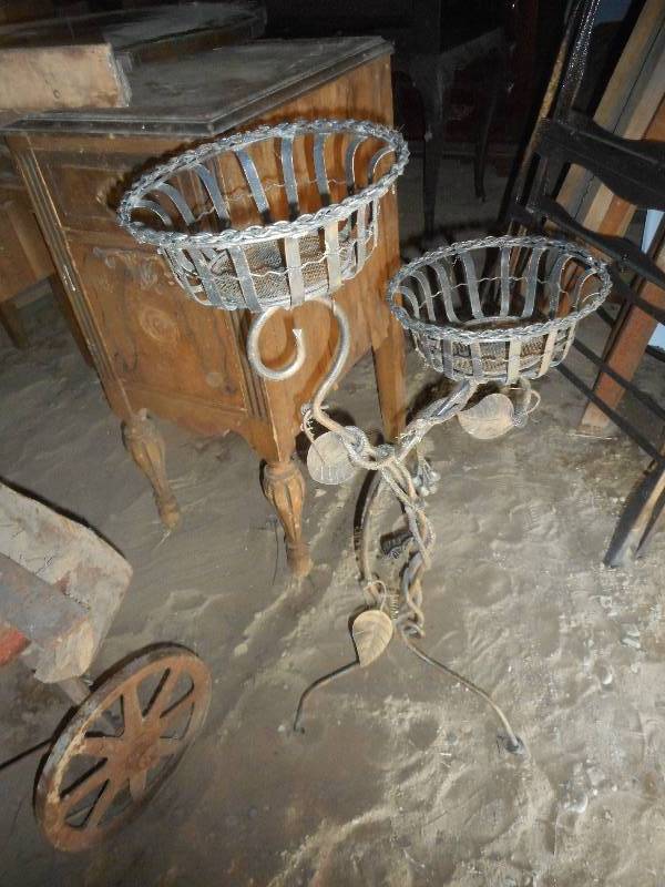 ANTIQUE IRON PLANT STAND .