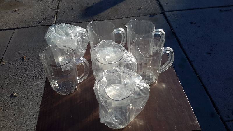 Set of 7 clear plastic pour pitchers