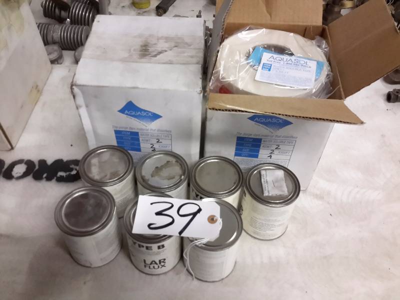 lot 39 image: 7 Cans of TYPE B Solar Flux  2 Boxes of Aquasol Water Soluble Tape