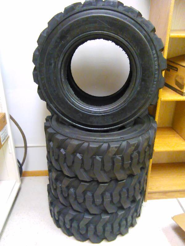 lot 1 image: Skid Loader Tires (4) 12-16.5 N.H.S. Allied RBT