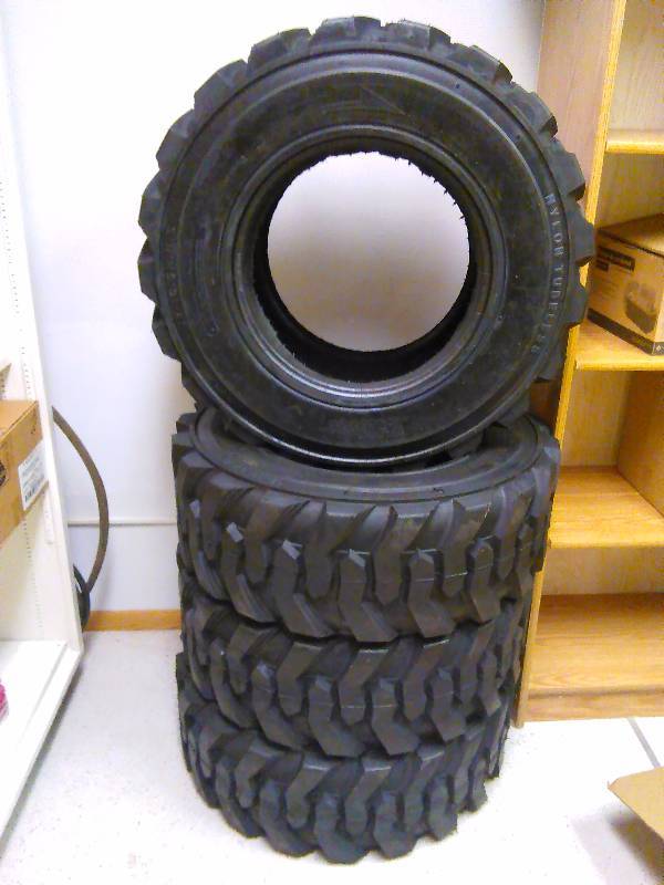 lot 2 image: Skid Loader Tires (4) 10-16.5 N.H.S. Allied RBT