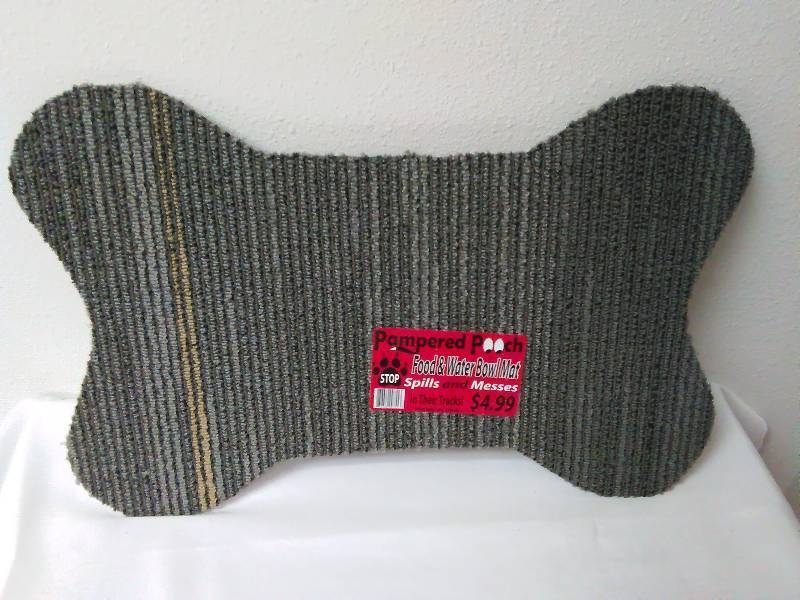 lot 252 image: Pet Bone Floor mat, Grey, rubber backed, Measures 17 in. x 11 in.