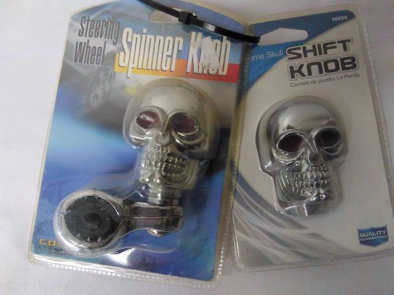 lot 348 image: Steering Wheel Spinner and Shift Gear Knob (Red Eyed Skulls)