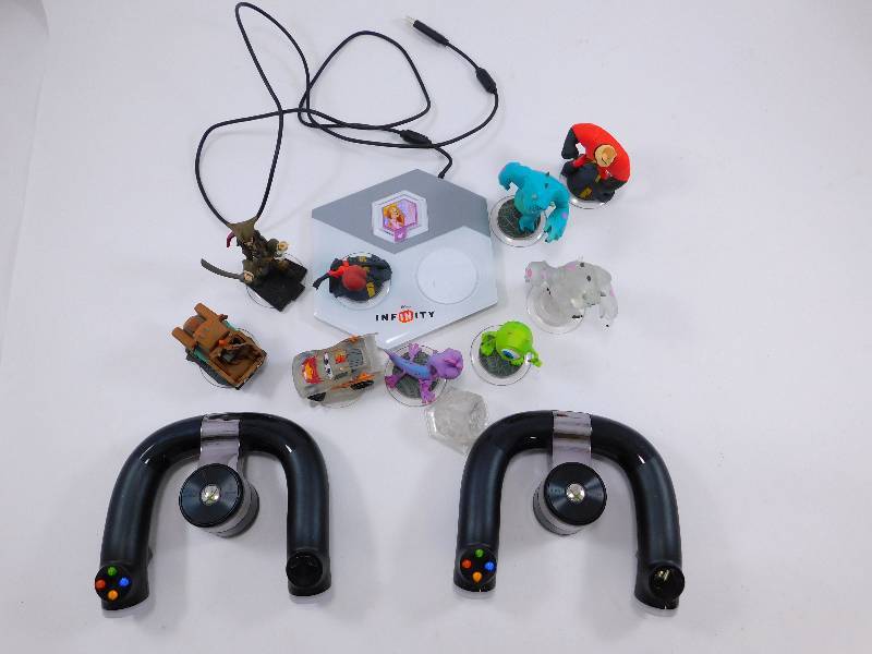 lot 65 image: 2 Xbox Steering Wheel Controllers and Wii Game