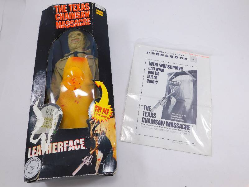 lot 66 image: Texas Chainsaw Massacre Leatherface Doll and Original Pressbook