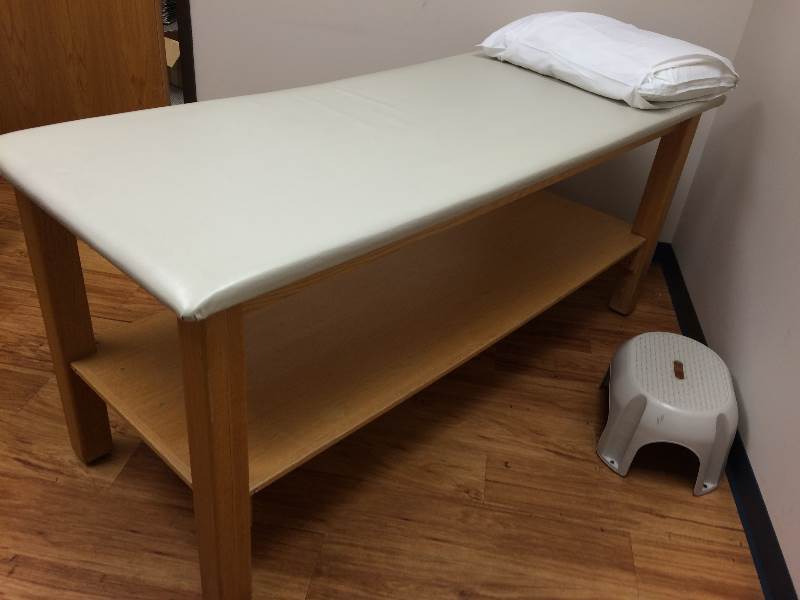 lot 92 image: Extra Heavy Duty H-Brace Medical Examination Exam Upholstered Padded Treatment Table With Shelf Below & Paper Roll Dispense Bars - Excellent Condition Could be used for massage as well