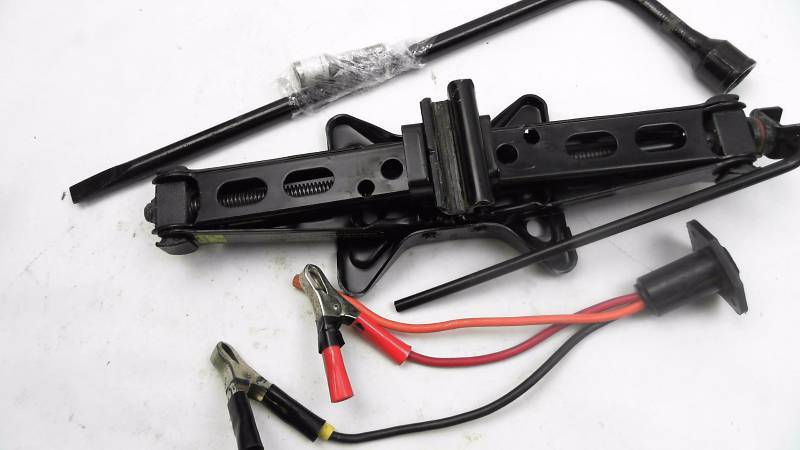 lot 115 image: Factory Scissor Jack and Lug Wrench for 2004 Chevy Cavalier