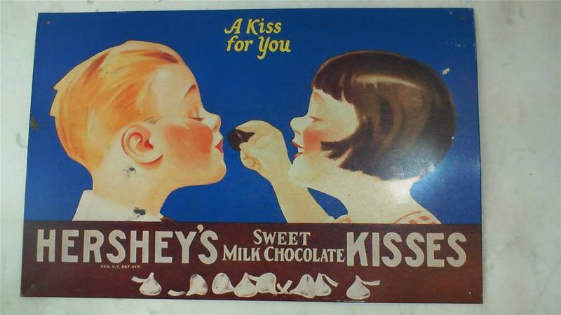 lot 442 image: Hershey Kiss replica vintage sign 10.5 high x 16 wide