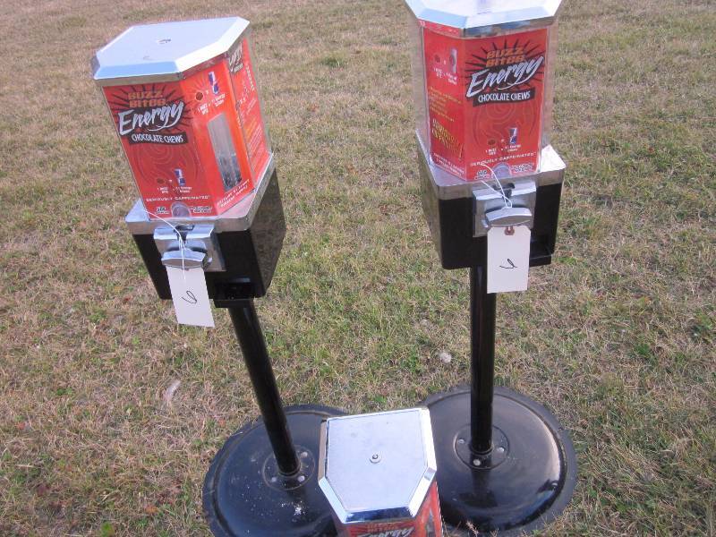 2 Buzz Bite Vending Machines on Stands and 1 Machine without a Stand