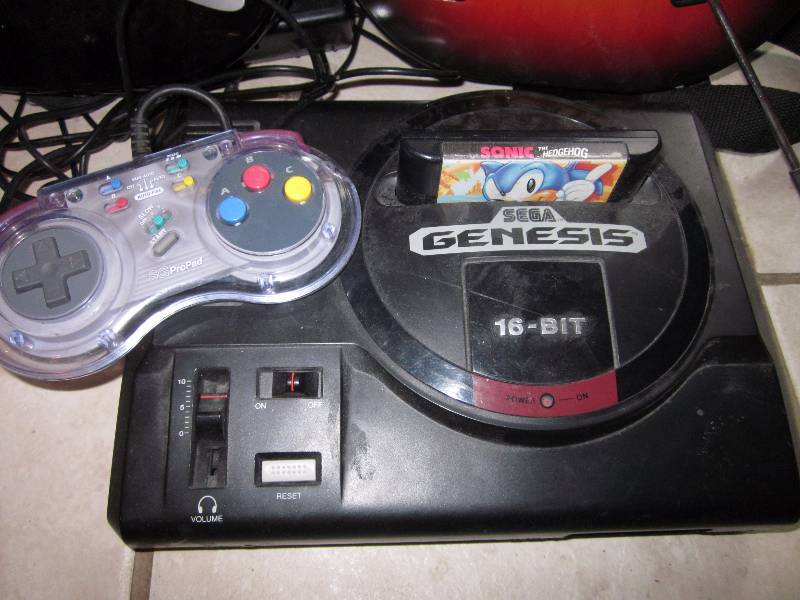 Sega Genesis Gaming System, 2 Guitars, and Drum Kit