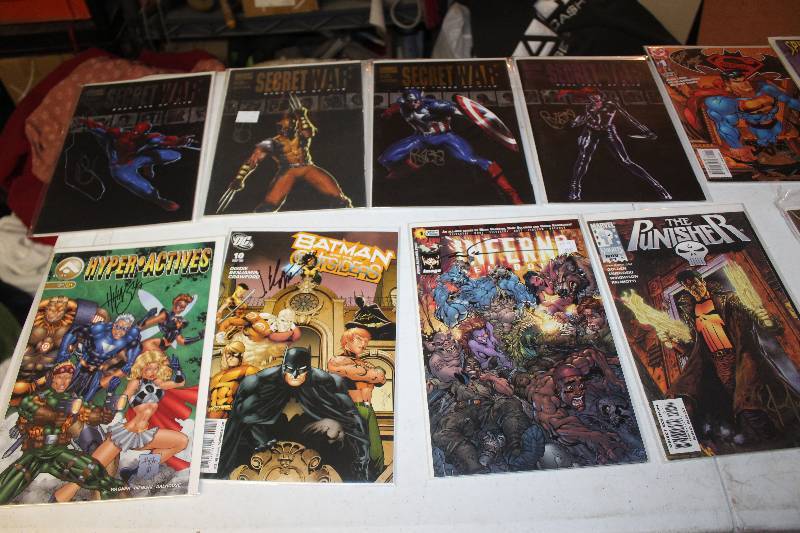 lot 1 image: Lot of (13) Signed DC, Marvel Comics Secret Wars Issues 1-5, Spider-man, Superman, Teen Titans, The Punisher, Inferno, Batman, Hyperactives Comic Books