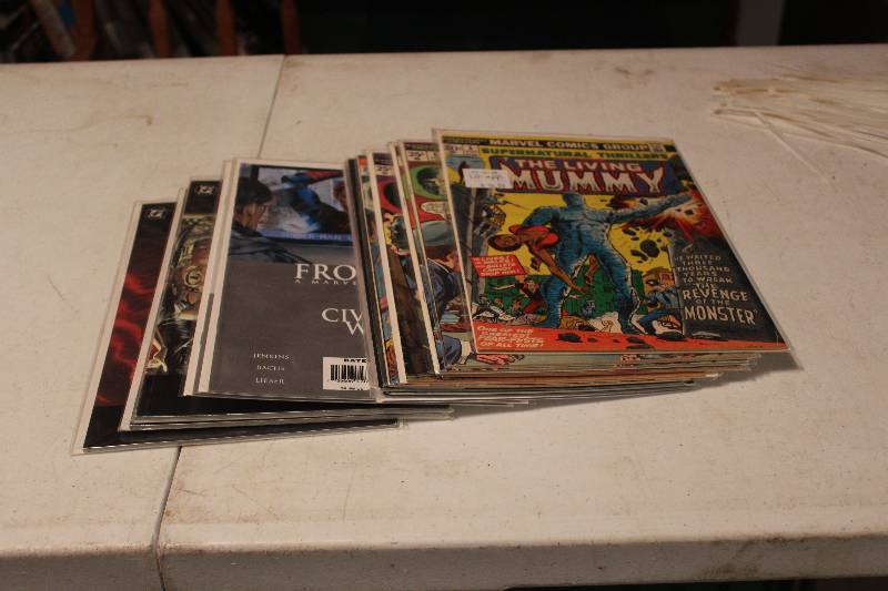 lot 68 image: Lot of (15) DC, Marvel Comics Civil War, The Living Mummy, The Crow, Kingdom Come Comic Books