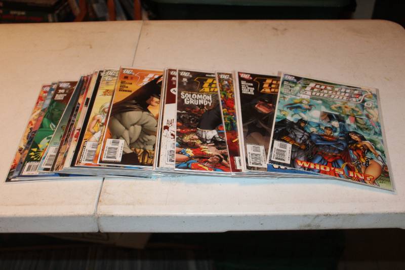 lot 110 image: Lot of (25) DC Comics Justice League of America Comic Books w Signed