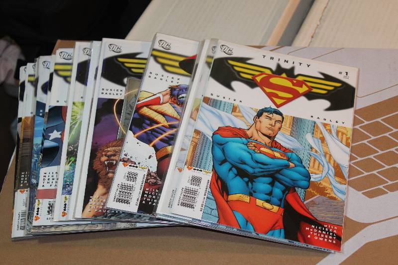 lot 162 image: Lot of (24) DC Comics Trinity Comic Books w Sleeves