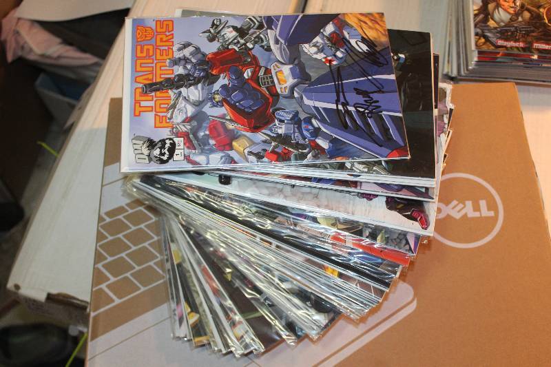 lot 218 image: Lot of (45) DW Comics Transformers Comic Books w Signed, Sleeves