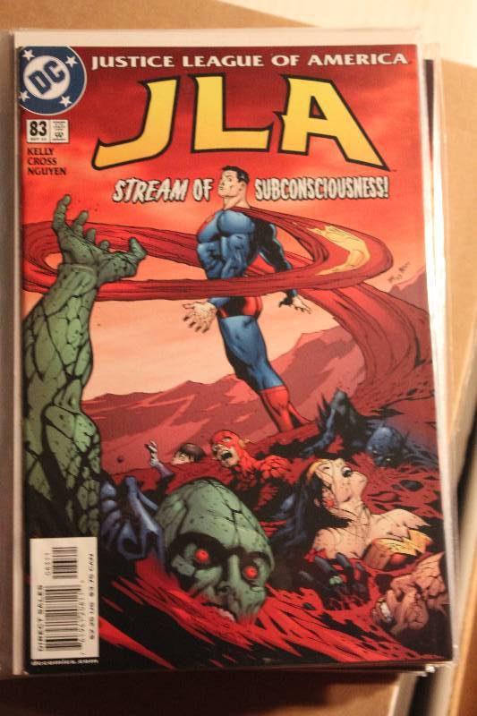 lot 203 image: Lot of (32) DC Comics JLA Comic Books w Sleeves